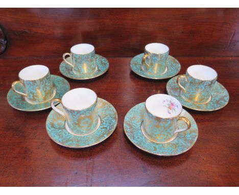 A set of six Minton brocade coffee cans and saucers, all good 