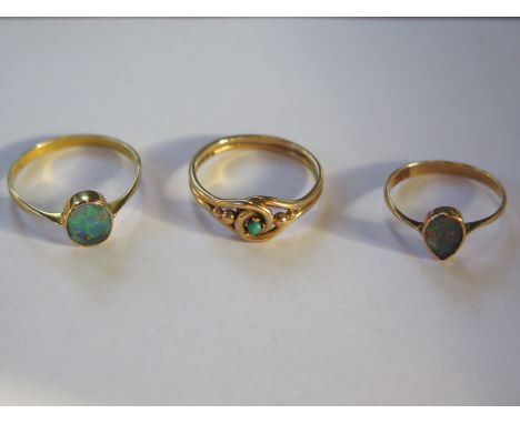 An 18ct gold turquoise ring, approx 3 grams, size N, together with a 15ct gold opal ring, and a yellow metal and opal ring, a