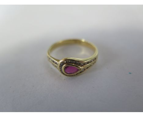 An 18ct yellow gold ruby and diamond ring, size O, approx 2.8 grams, some usage marks and abrasions, all stones present 