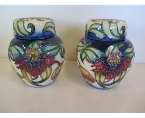A pair of 1998 Moorcroft Anna Lily pattern ginger jars with lids, approx 11cm high - with some light cosmetic wear, otherwise