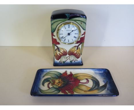 A 1998 Moorcroft Anna Lily cased mantle clock - approx 16cm high - and a Moorcroft pin tray in the same pattern, approx 20cm 