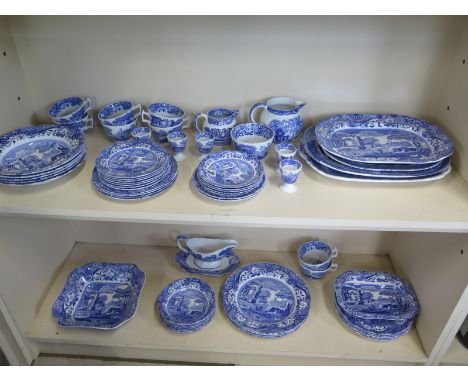 A Spode Italian dinner and tea service - 56 pieces and three blue and white meat dishes, a milk jug  - all in generally good 