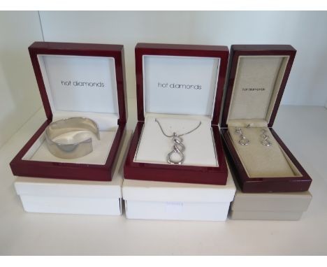 A hot diamonds silver necklace and matching earrings and bangle, all boxed 