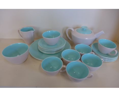 A Poole Pottery part tea service with tea pot, milk jug, sugar bowl, serving plate, six tea plates, six cups and saucers and 