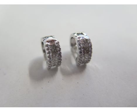 A pair of 18ct white gold and diamond earrings, approx 4.3 grams, 13mm wide in good condition 