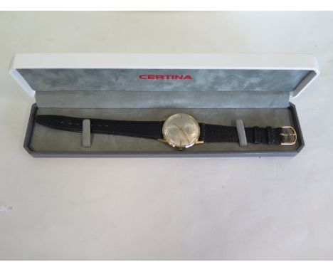 A Certina gold, manual wind gents wristwatch, 34mm wide including button, in a clean and running condition 