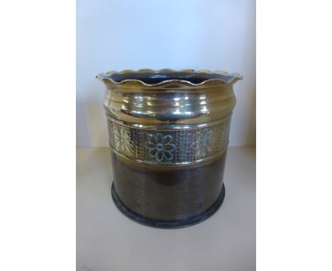 A WW1, 1917 trench art German shell case planter with impressed floral pattern, approximately 23cm high, 24cm diameter, with 