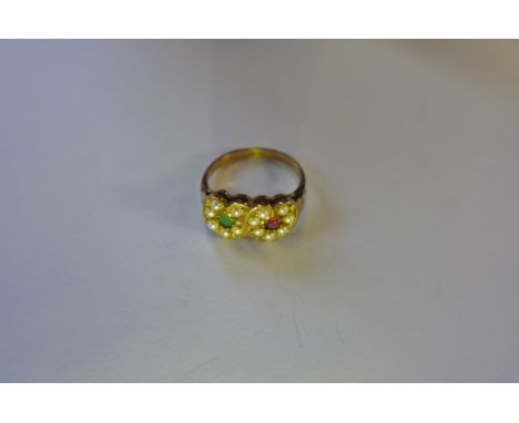 A 9ct gold ring with two intertwined hearts inset with an emerald, ruby and seed pearls, ring size N, approximately 3g 