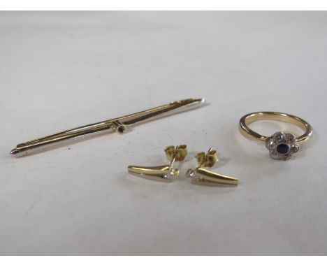 A pair of 14ct gold earrings, ring and brooch, each earring inset with a single white stone, a diamond and sapphire ring whic