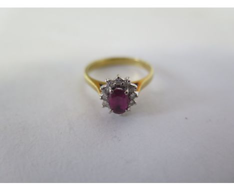 An 18ct yellow gold ring set with small diamonds, size L, approx 3 grams, some minor wear 