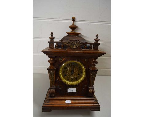 EDWARDIAN MANTEL CLOCK IN CARVED WOODEN CASE