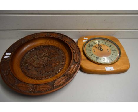WALL CLOCK IN WOODEN FRAME TOGETHER WITH A LARGE WOODEN CIRCULAR TRAY CARVED WITH OAK LEAVES