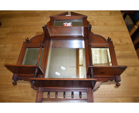 LATE 19TH/EARLY 20TH CENTURY SMALL FOUR PANEL OVERMANTEL MIRROR SET IN A CARVED AND SPINDLE DECORATED FRAME, 70CM HIGH APPROX