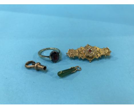 A 9ct ring, a brooch, a gold mounted jade pendant etc.