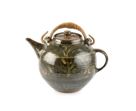 Michael Cardew (1901-1983) at Winchcombe PotteryLarge teapotwith dark grey glaze and yellow brushwork design, metal handleimp