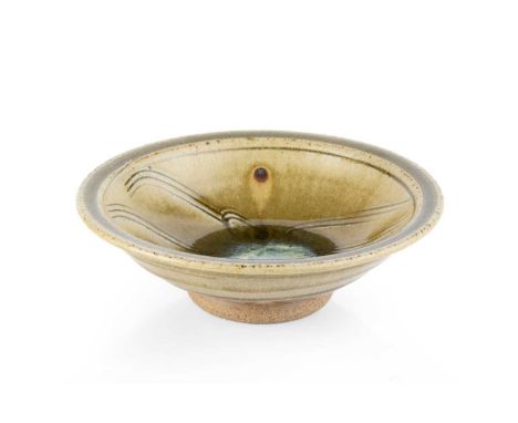 Jim Malone (b.1946)Footed dishwith green ash glaze, incised decoration with blue glaze to the wellimpressed potter's seal18.5