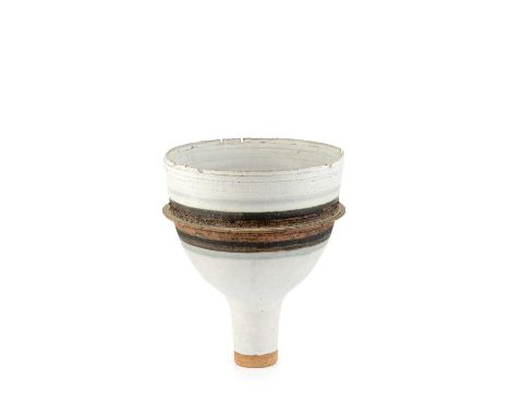 Robin Welch (1936-2019)Footed bowl, 1988stoneware, with cream glaze and a band of dark glaze with a raised lipimpressed potte