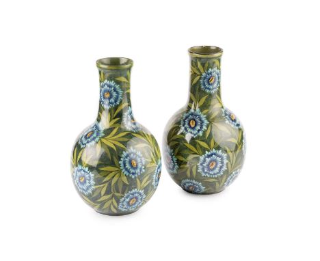 Doulton Lambeth A pair of Faience vases, 1881decorated with blue flowers on a leaf backgroundimpressed factory marks and date