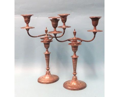 A matched pair of Adam-style two-branch candelabra with tapering oval columns, on oval bases, 34.5cm high, maker Walker &amp;