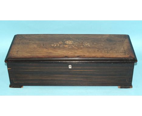 A Nicole Freres rosewood and grained music box playing ten airs, having a single drum and signed comb, Stop, Play, Change and