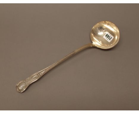 A Victorian silver double struck King's pattern soup ladle, crest engraved, London 1858, weight 298 gms.