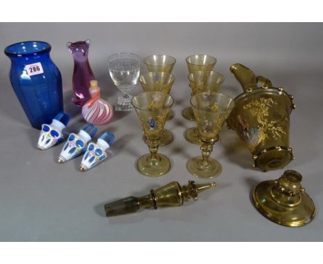 Glassware, comprising; a group of six Continental amber tinted wine glasses and goblet, a group of three blue glass decanter 