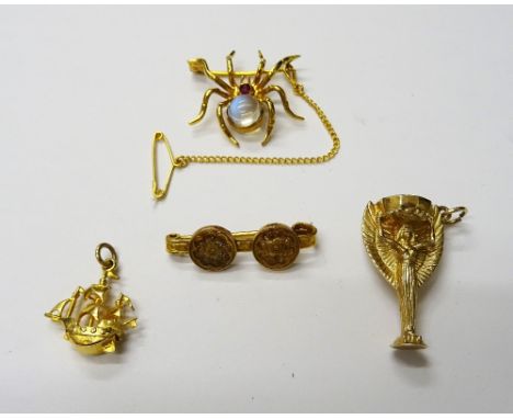 A gold, ruby and moonstone brooch, designed as a spider, a 9ct gold pendant, designed as The World Cup, detailed England 1966