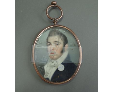 An early 19th century Anglo-Irish school portrait on miniature of a young man, white stock, blue coat, damaged gold coloured 