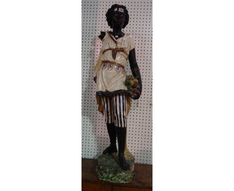 A ceramic Blackamoor figure, 110cm high, (a.f.) 