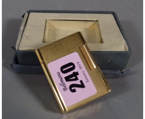 S. T. Dupont; a gold plated lighter.