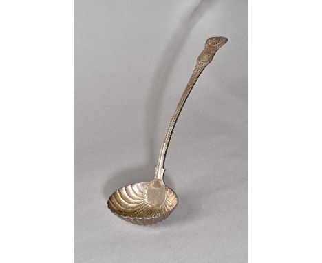 A William IV silver Kings pattern soup ladle, the oval bowl with scallop fluted decoration, London 1835, weight 330 gms. 