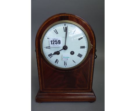 An Edwardian mahogany cased mantel clock of dome form with a white enamel dial and two train movement (26cm high) and a moder