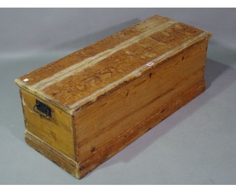 An early 20th century pine rectangular lift top trunk, 95cm wide x 35cm high. 
