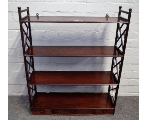 A George III mahogany three tier hanging shelf, with Cockpen sides, the lower tier with three drawers, 70cm wide x 86cm high.