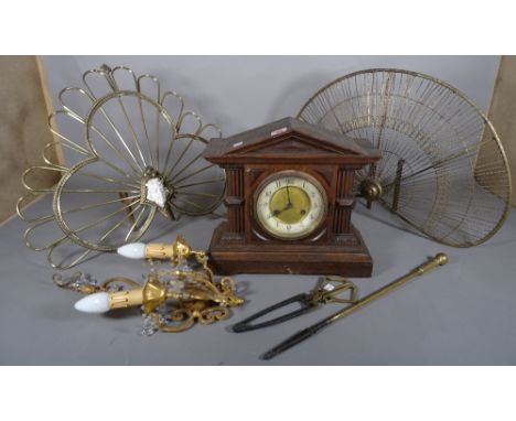 Metalware including; a group of four brass fire screens, a group of fire tools, a wall light and an oak cased mantel clock, (