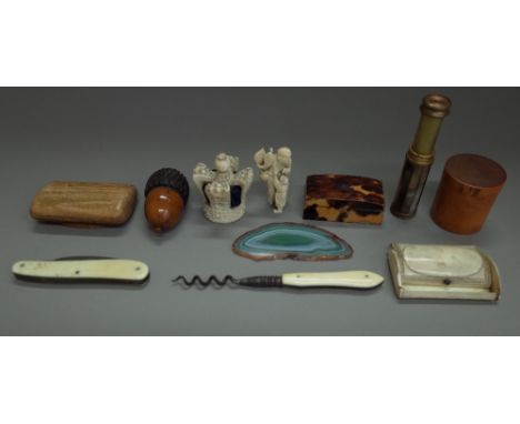 A quantity of small collectables, including; a fruitwood carved 'acorn' serving spool, 6cm, an early 20th century ivory 'crow