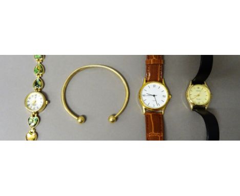 A 9ct gold torque bangle, weight 4 gms, a Sekonda Quartz lady's wristwatch, with a Sekonda box and two further wristwatches, 
