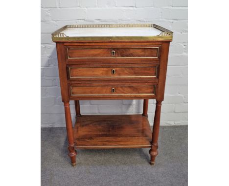 A 19th century French petite commode, the brass galleried marble top over three drawers and platform undertier, 54cm wide x 8