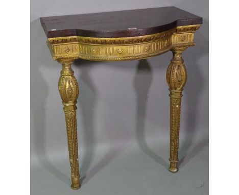 A Regency style gilt wood bowfront console table with later added mahogany top on taping supports, 67cm wide x 81cm high. 