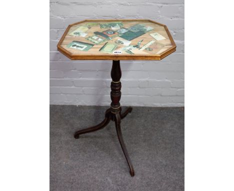 An early 19th century occasional table with trompe l'oeil top on a faux rosewood tripod base, 48cm wide x 78cm high. 