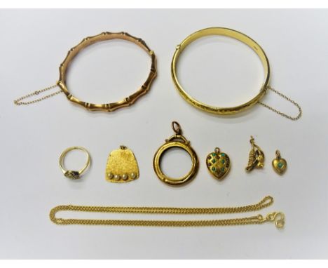 A late Victorian 9ct gold oval hinged bangle, in a simulated bamboo design, on a snap clasp, Birmingham 1896, a 9ct gold oval