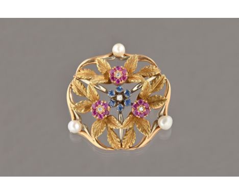 A gold, diamond, sapphire, ruby and cultured pearl set brooch, in a pierced foliate design, mounted with a central sapphire a