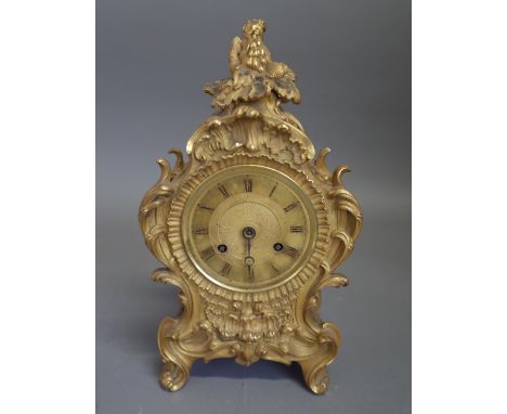 A French ormolu mantel clockIn the Louis XV style, circa 1850The case of shaped outline, cast with foliage and flowers, with 