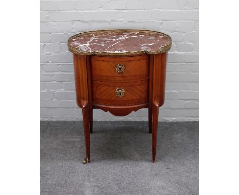 A Louis XVI style petite commode, the shaped brass galleried marble top over a pair of drawers, on shallow cabriole supports,