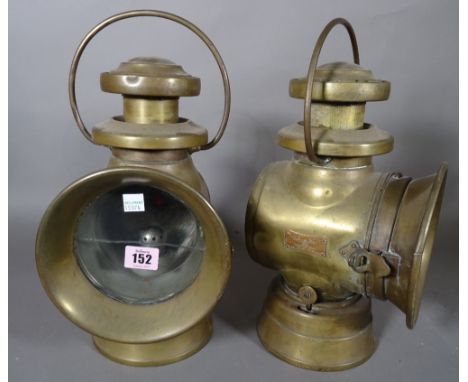 A pair of five inch Lucas 'Kind of the Road' green painted brass cased automobile oil lamps, (2).