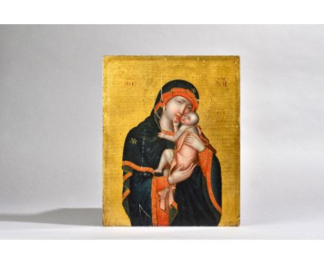 A Russian icon painted on board, 19th century, depicting Madonna and Child against a gilt ground with an oil portrait of a be