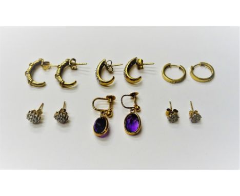 A pair of gold and diamond set earrings, in a curved design, the backs with post and butterfly clip fittings, a pair of gold 