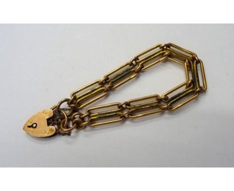 A 9ct gold bar and oval link gate bracelet, in a two row design as converted from a watch Albert chain, fitted with a heart s