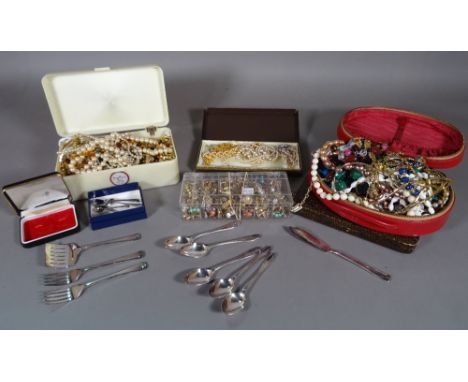 A quantity of mostly 20th century costume jewellery and a quantity of silver plated flatware, (qty). 