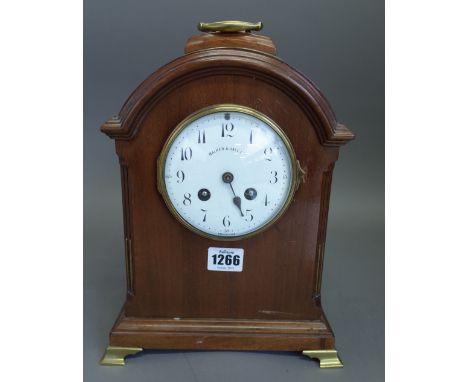 A mahogany cased arch top mantel clock, late 19th century, brass handle above the white enamel dial detailed 'WALKER & HALL L